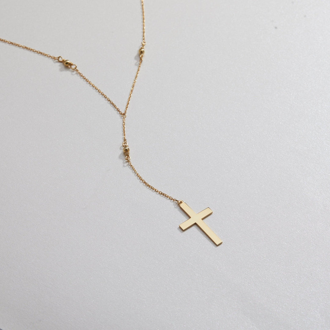 Macro detail of the Cross Pendant Necklace showcasing craftsmanship in 18K Gold Vermeil. Tarnish-resistant, handmade.