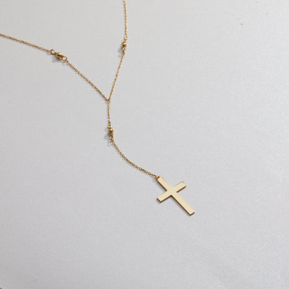 Macro detail of the Cross Pendant Necklace showcasing craftsmanship in 18K Gold Vermeil. Tarnish-resistant, handmade.