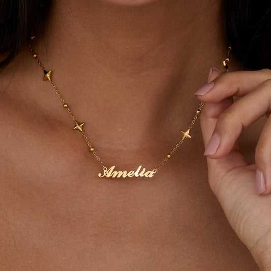 Close detail of the Custom Name Necklace with Star Charms in Gold-Plated Steel. Safe for sensitive skin, premium handmade.