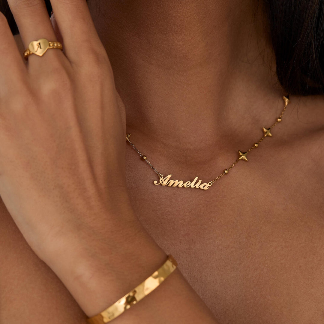 Custom Name Necklace with Star Charms as a thoughtful birthday gift in Gold-Plated Steel. Hypoallergenic, no green marks.