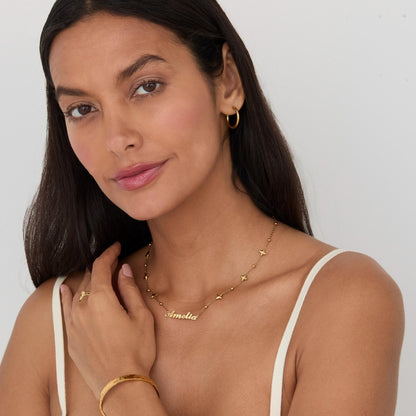 The Custom Name Necklace with Star Charms worn in Gold-Plated Steel — refined accessory for women. Safe for sensitive skin.