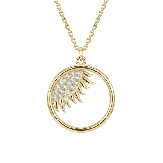 Dainty Evil Eye Sun Necklace in 14K solid gold: an open circle pendant with an almond-shaped eye of 18 clear CZ stones and gold sun rays.