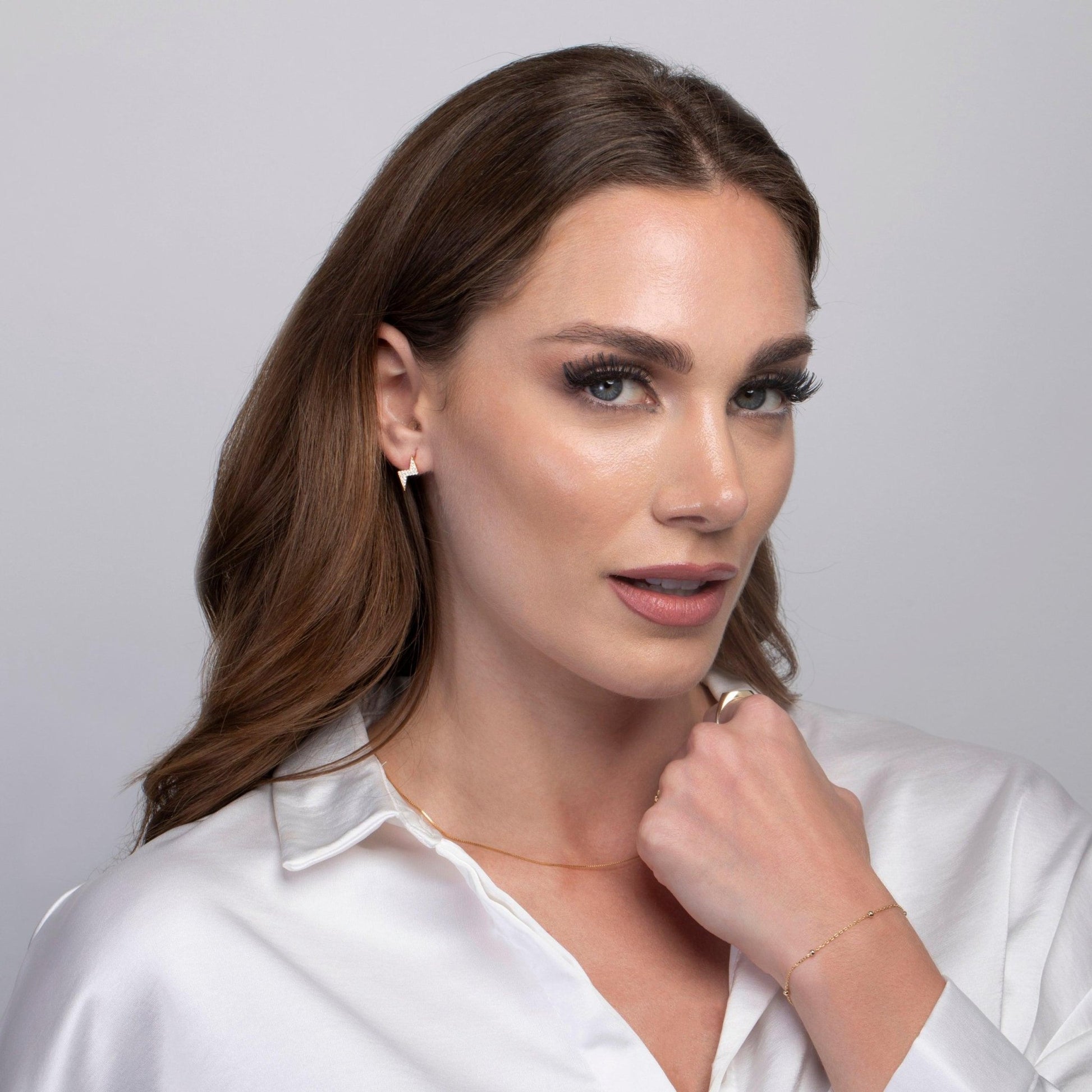 Dainty Lightning Bolt Stud Earrings as a thoughtful birthday gift in 18K Gold Vermeil. Hypoallergenic for sensitive ears.