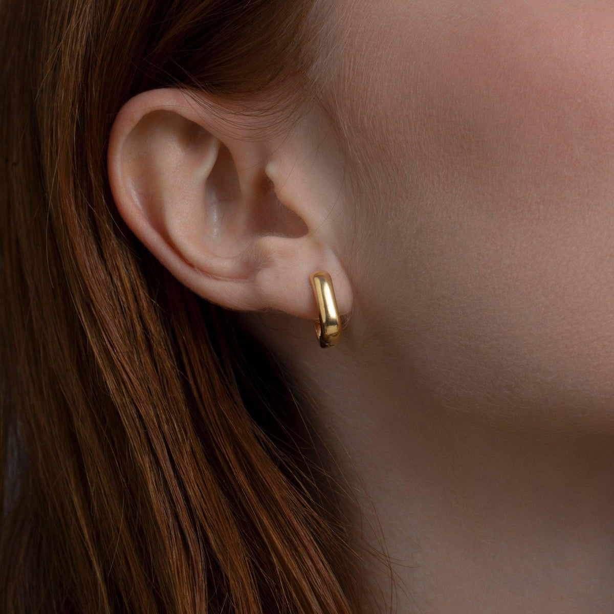 Close detail of the Dainty Square Huggie Hoop Earrings in 18K Gold Vermeil. Tarnish-resistant, premium handmade jewelry.