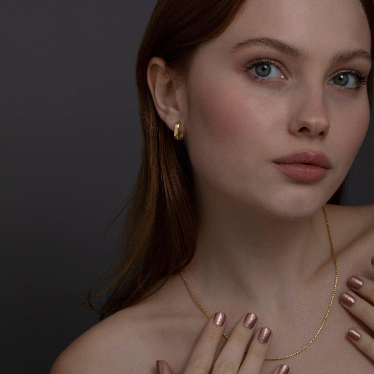 The Dainty Square Huggie Hoop Earrings styled in 18K Gold Vermeil — elegant everyday jewelry. Hypoallergenic for sensitive.