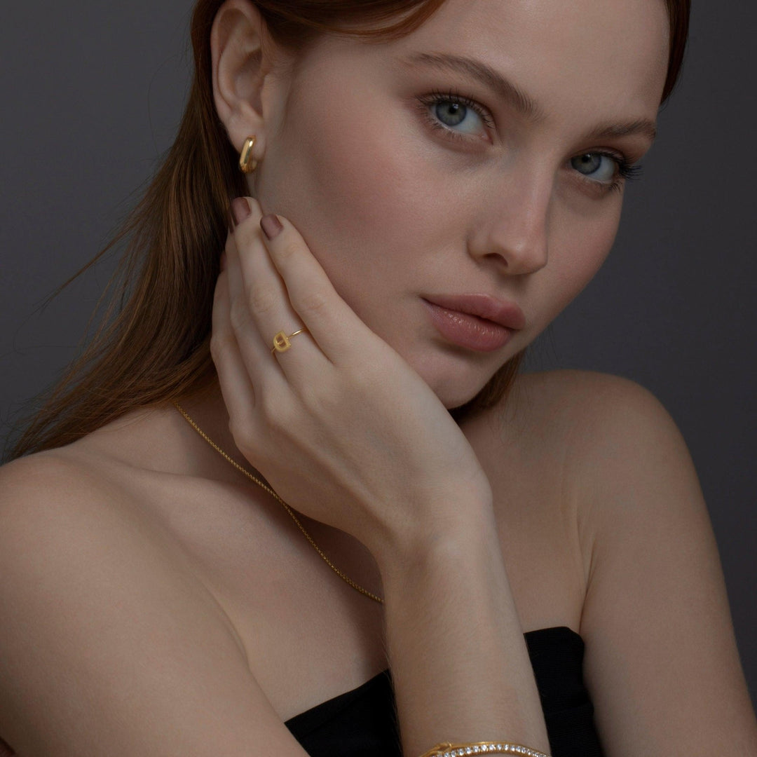 The Dainty Square Huggie Hoop Earrings as a graduation gift in 18K Gold Vermeil. Tarnish-resistant, made for keeping.