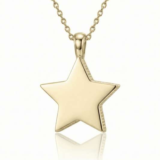 Dainty star necklace in 14K solid gold: a small polished star pendant on a cable chain, on a white background.