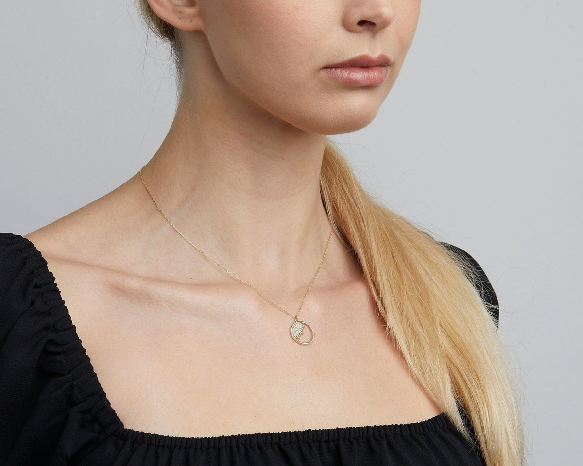 Close detail of the Dainty Evil Eye Sun Necklace in 18K Gold Vermeil. Safe for sensitive skin, premium handmade jewelry.