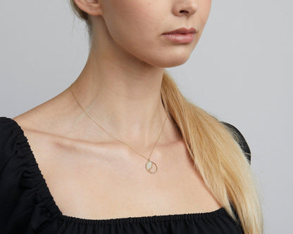 Close detail of the Dainty Evil Eye Sun Necklace in 18K Gold Vermeil. Safe for sensitive skin, premium handmade jewelry.