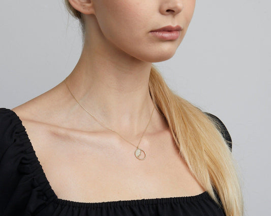 Close detail of the Dainty Evil Eye Sun Necklace in 18K Gold Vermeil. Safe for sensitive skin, premium handmade jewelry.