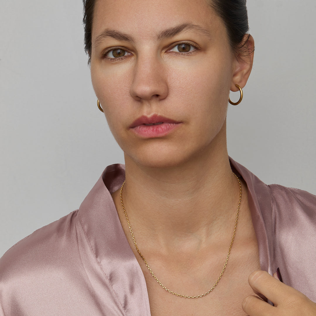 Diamond Cut Cable Chain Necklace worn with a silk blouse — minimalist gold chain necklace.