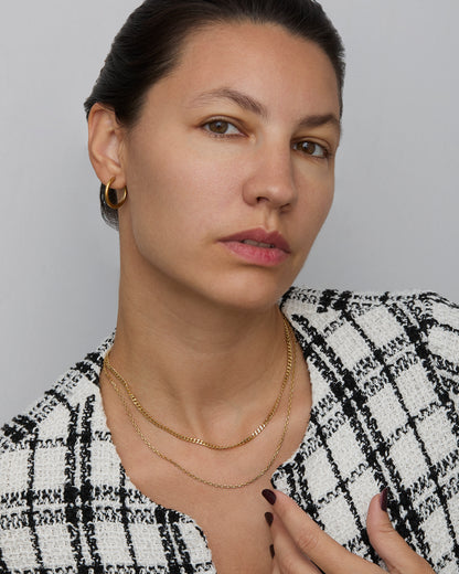 Diamond Cut Cable Chain Necklace layered with a second gold chain — layering necklace look.