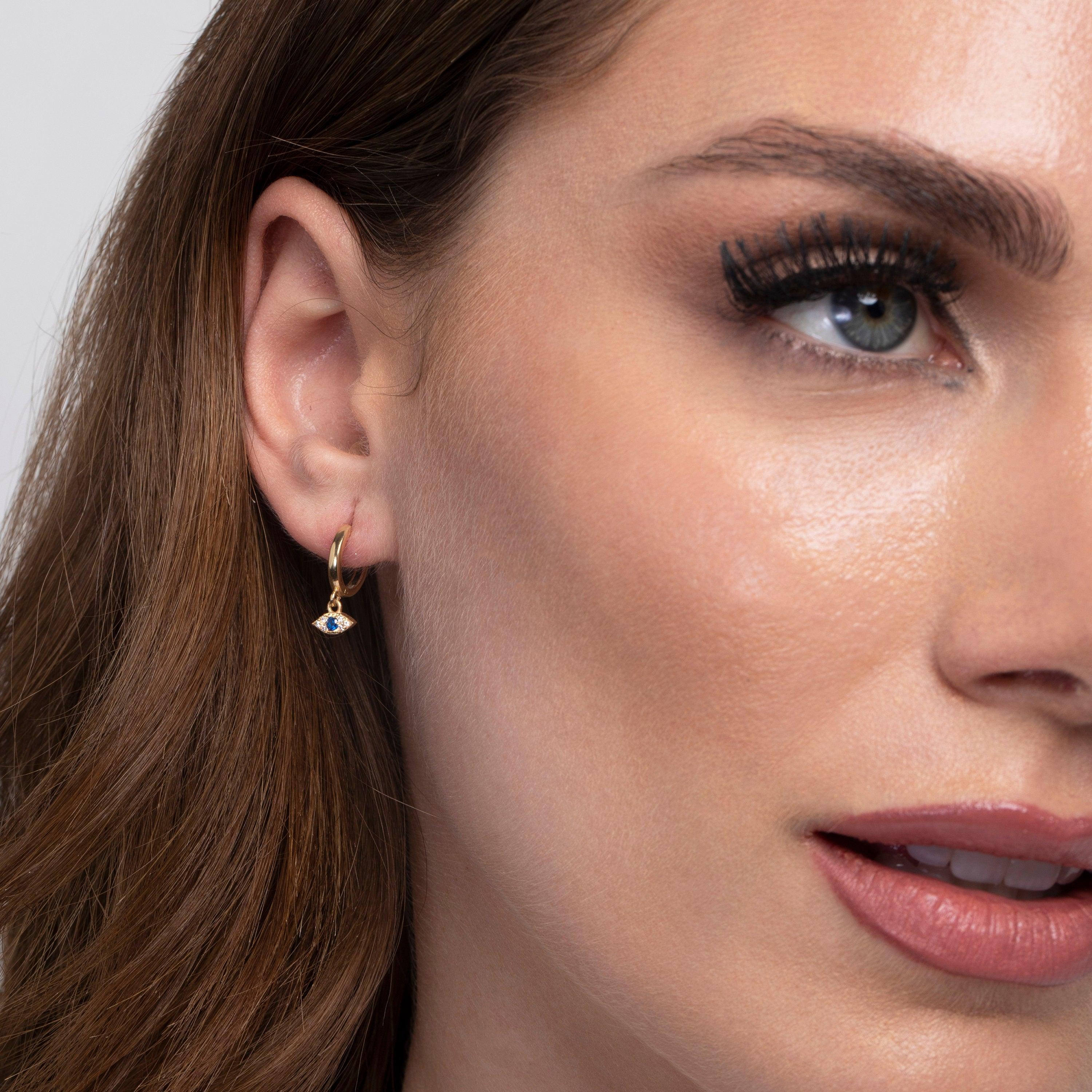 The Diamond Evil Eye Hoop Earrings styled in 18K Gold Vermeil — elegant everyday jewelry. Hypoallergenic for sensitive ears.