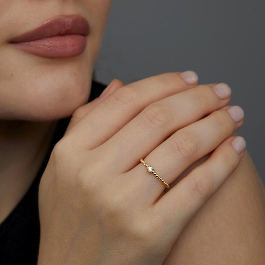 Close detail of the Diamond Beaded Band Ring in 18K Gold Vermeil with CZ Diamond. Hypoallergenic, no green marks, premium.