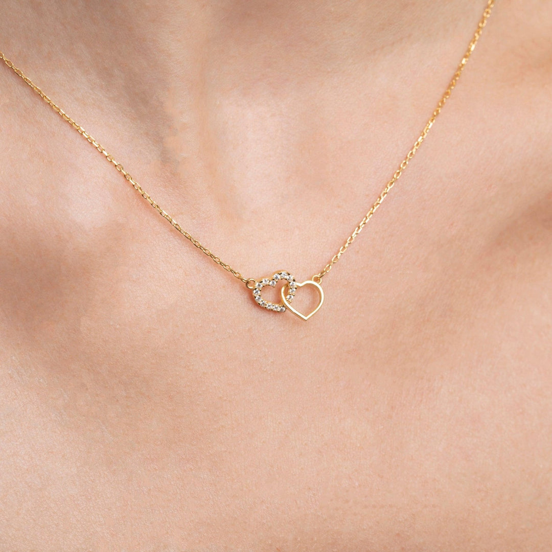 Close detail of the Double Heart Necklace in 18K Gold Vermeil. Safe for sensitive skin, premium handmade jewelry.