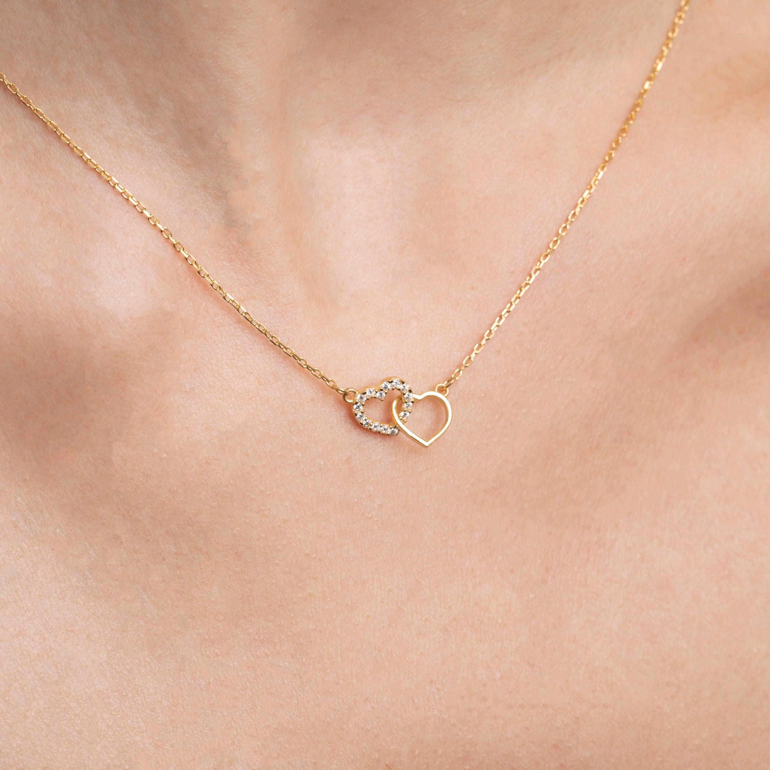 Close detail of the Double Heart Necklace in 18K Gold Vermeil. Safe for sensitive skin, premium handmade jewelry.