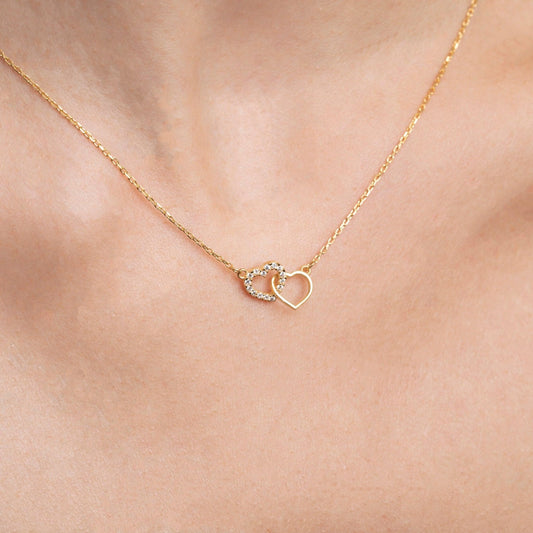 Close detail of the Double Heart Necklace in 18K Gold Vermeil. Safe for sensitive skin, premium handmade jewelry.