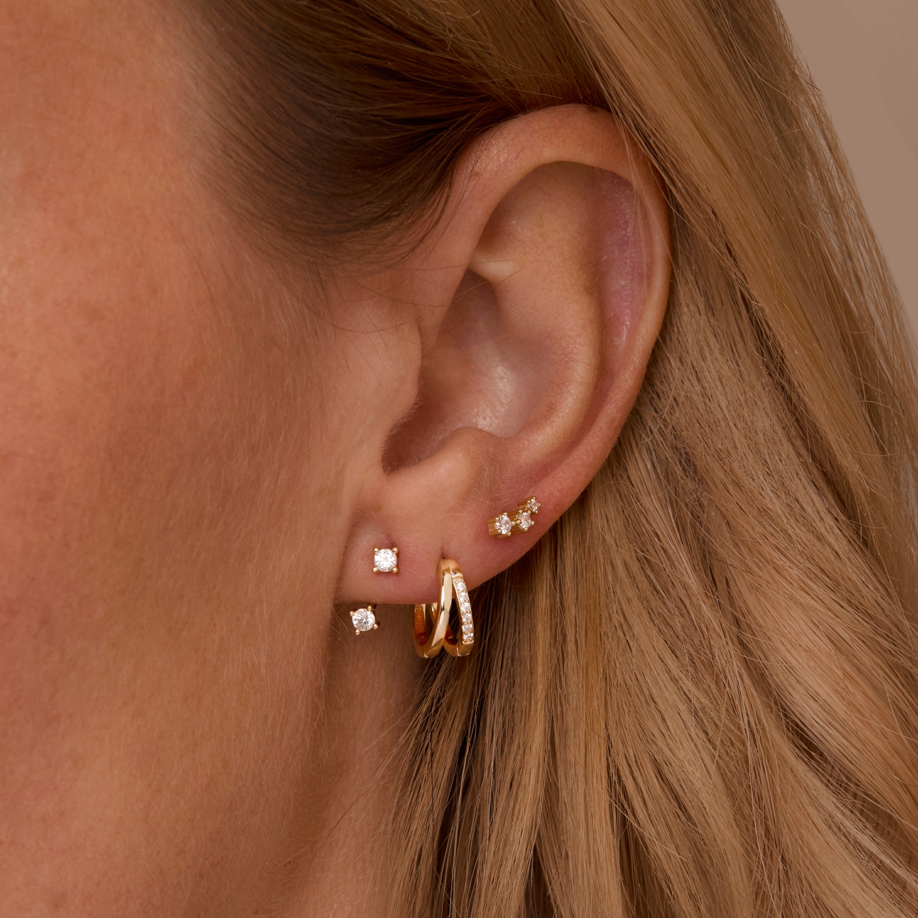 Double Hinge Hoop Ear Jacket Set styled with complementary pieces in 18K Gold Vermeil. Hypoallergenic for sensitive ears.