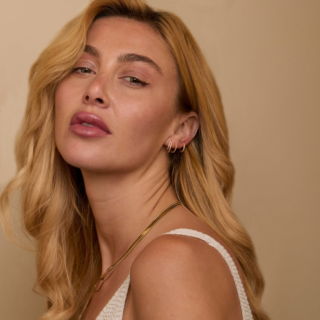 The Double Hoop Pavé Earring Set worn in 18K Gold Vermeil — refined accessory for women. Tarnish-resistant.