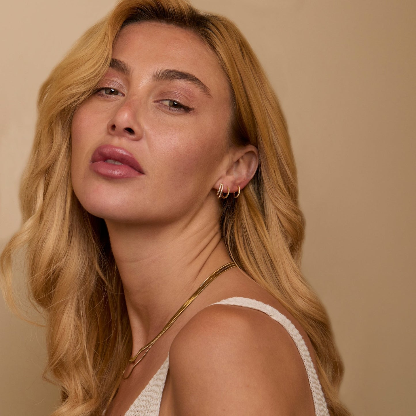 The Double Hoop Pavé Earring Set worn in 18K Gold Vermeil — refined accessory for women. Tarnish-resistant.