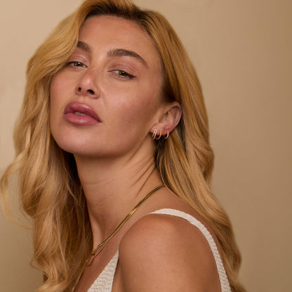 The Double Hoop Pavé Earring Set worn in 18K Gold Vermeil — refined accessory for women. Tarnish-resistant.