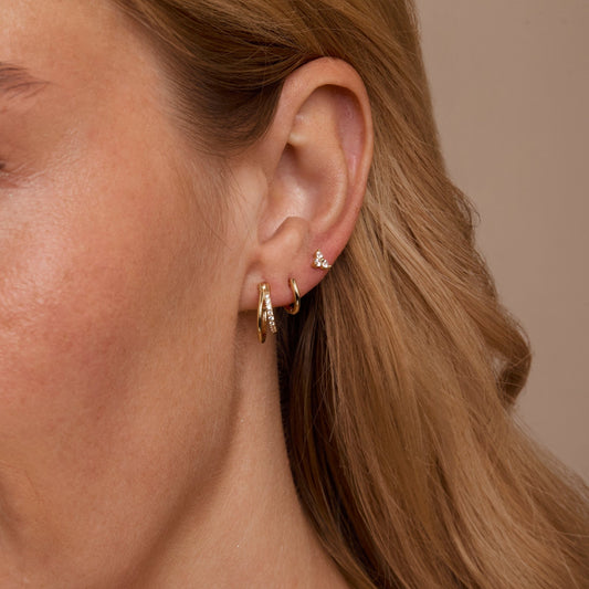 Close detail of the Double Hoop Stud Earring Set in 18K Gold Vermeil. Tarnish-resistant, premium handmade jewelry.