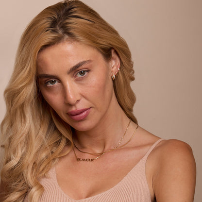 The Double Hoop Stud Earring Set worn in 18K Gold Vermeil — refined accessory for women. Tarnish-resistant.