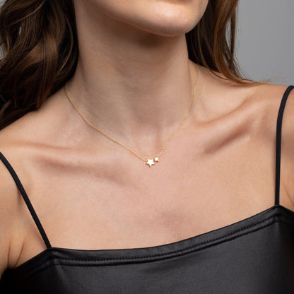 Close detail of the Double Star Pendant Necklace in 18K Gold Vermeil. Safe for sensitive skin, premium handmade jewelry.