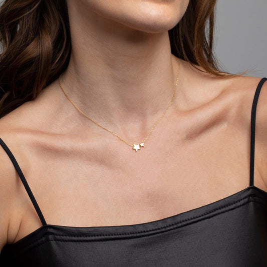 Close detail of the Double Star Pendant Necklace in 18K Gold Vermeil. Safe for sensitive skin, premium handmade jewelry.