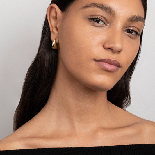 Close detail of the Chunky Earrings for Women in Gold-Plated Steel. Tarnish-resistant, premium handmade jewelry.