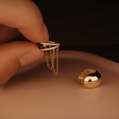 The Ear Cuff Chunky Huggie Hoops styled in 18K Gold Vermeil — elegant everyday jewelry. Hypoallergenic for sensitive ears.