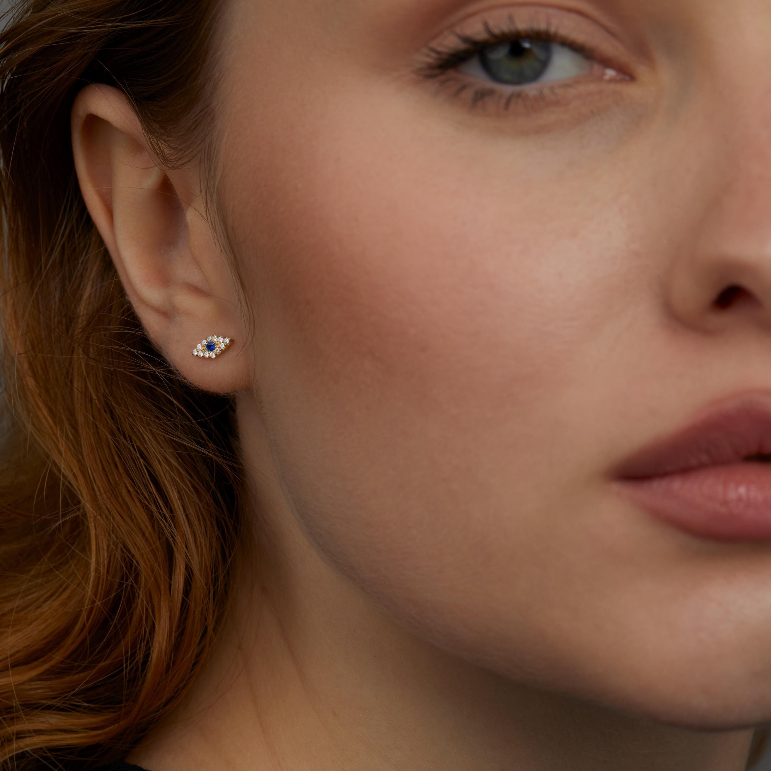 The Evil Eye Stud Earrings styled in 18K Gold Vermeil — elegant everyday jewelry. Hypoallergenic for sensitive ears.