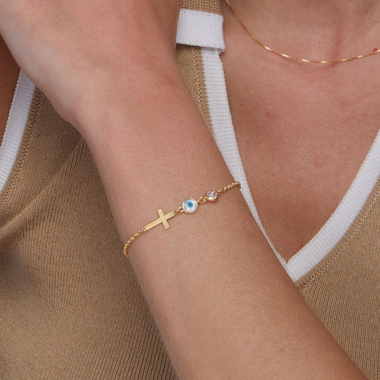 Close detail of the Evil Eye with Cross Bracelet in 18K Gold Vermeil. Safe for sensitive skin, premium handmade jewelry.