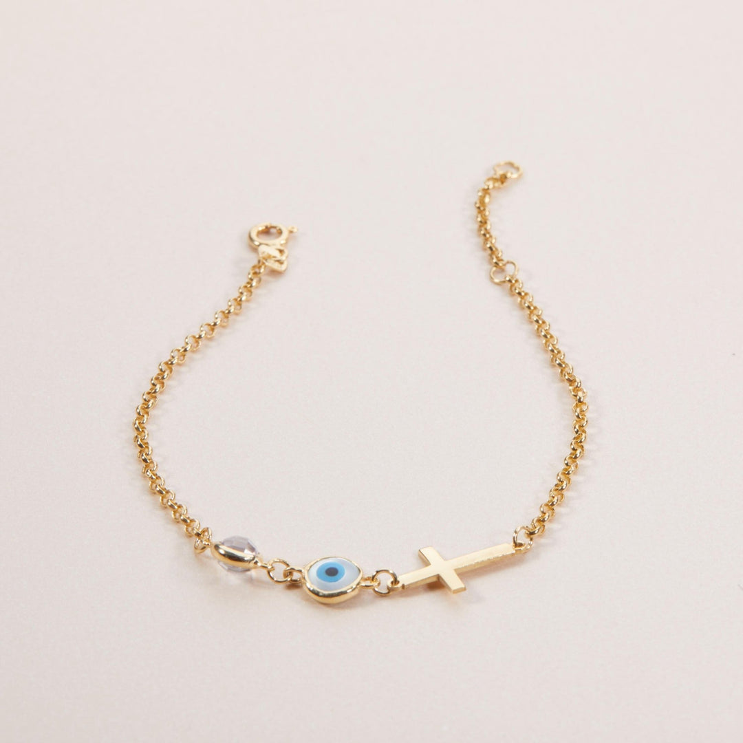 Macro detail of the Evil Eye with Cross Bracelet showcasing craftsmanship in 18K Gold Vermeil. Tarnish-resistant, handmade.