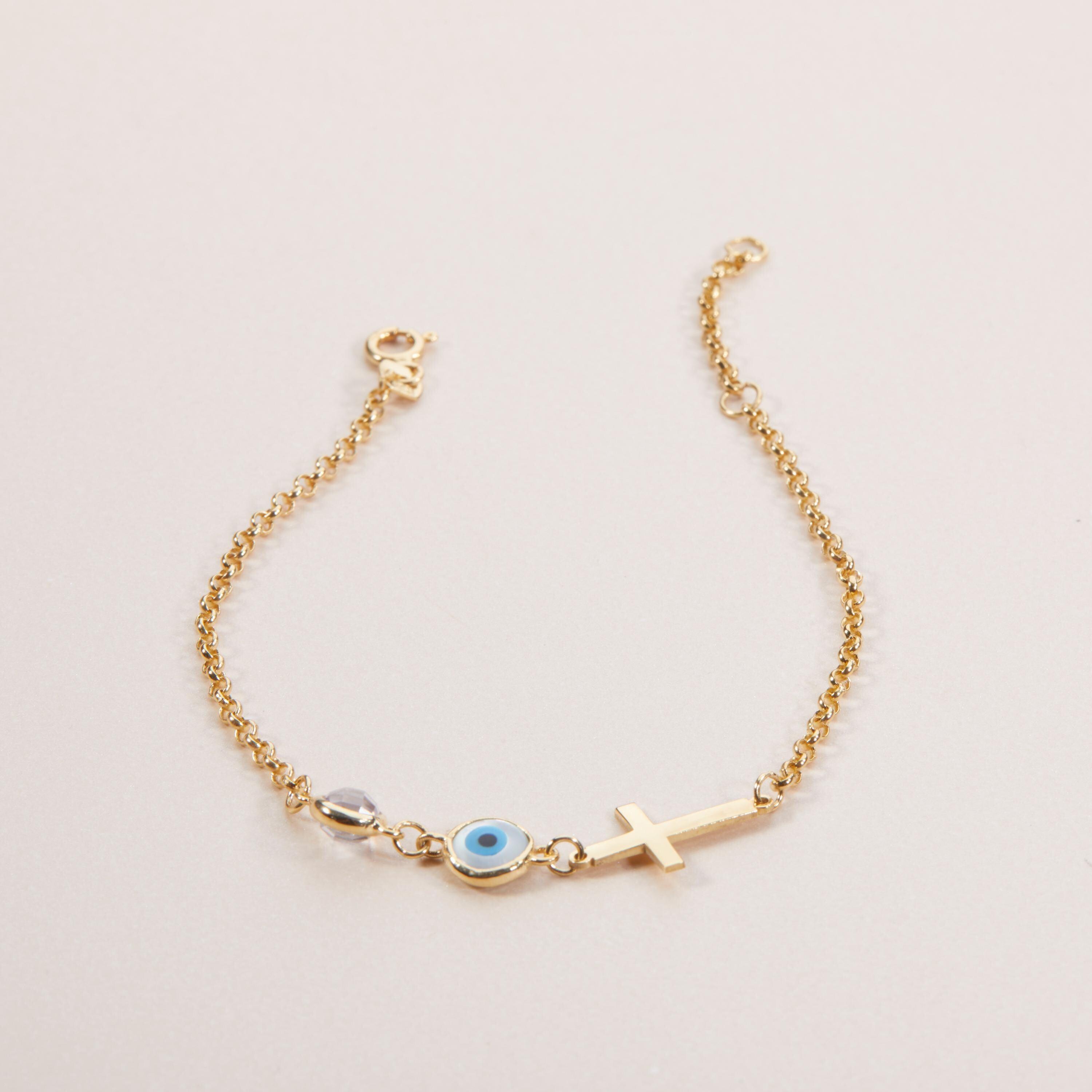 Macro detail of the Evil Eye with Cross Bracelet showcasing craftsmanship in 18K Gold Vermeil. Tarnish-resistant, handmade.