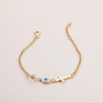 Macro detail of the Evil Eye with Cross Bracelet showcasing craftsmanship in 18K Gold Vermeil. Tarnish-resistant, handmade.