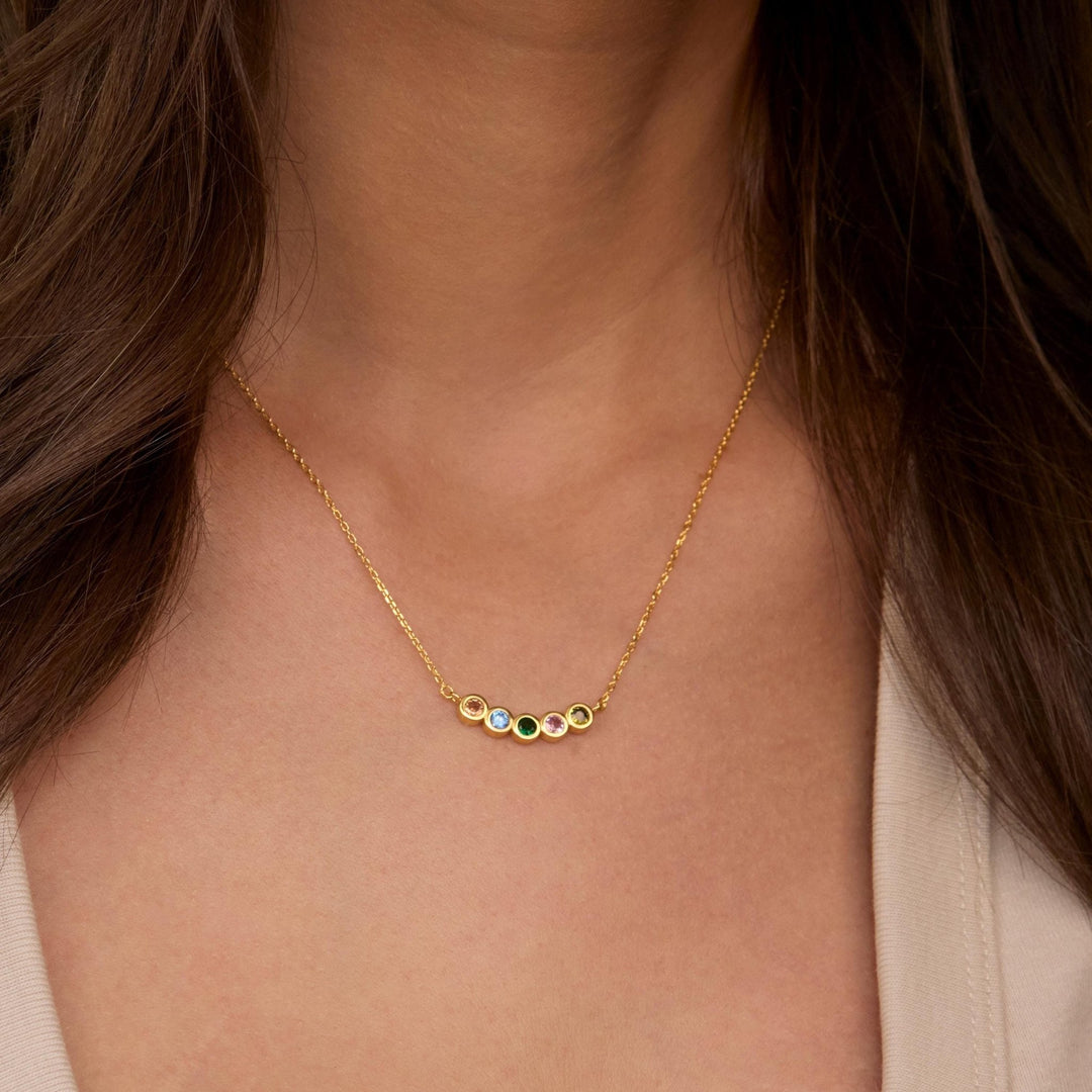 Macro detail of the Family Birthstone Necklace: Birthstone set in 18K Gold Vermeil. Tarnish-resistant, handmade jewelry.