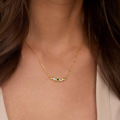 Macro detail of the Family Birthstone Necklace: Birthstone set in 18K Gold Vermeil. Tarnish-resistant, handmade jewelry.