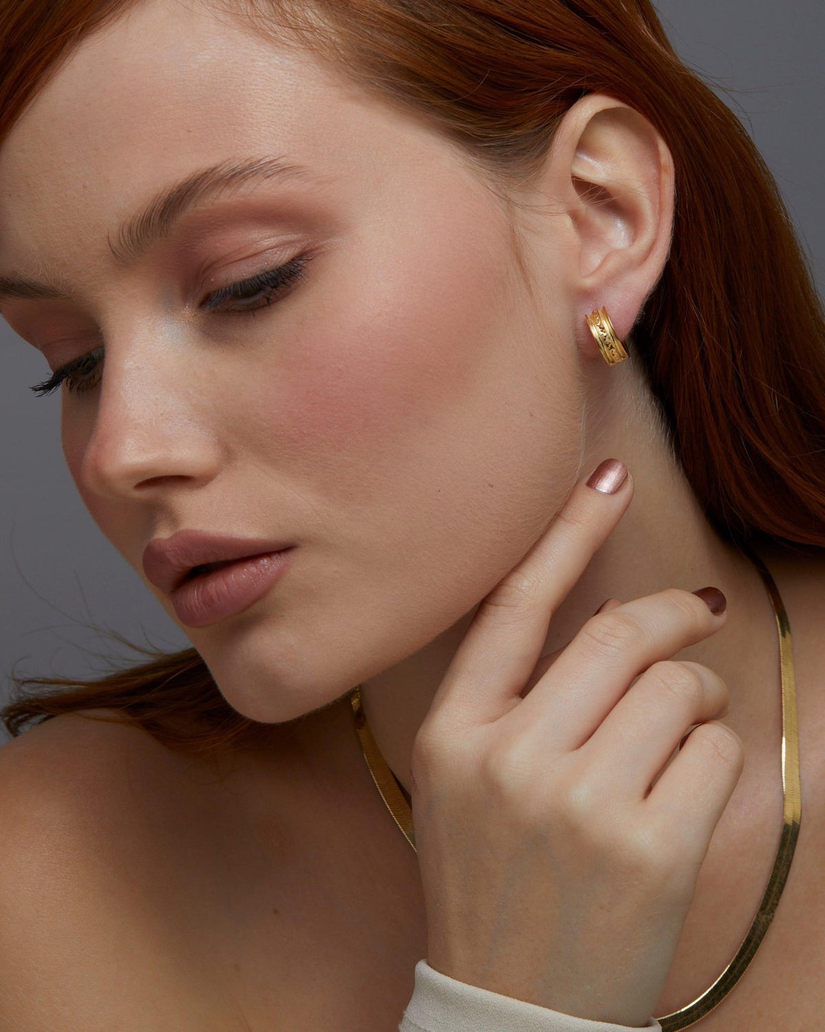 Fashion Gold Huggie Hoop Earring as a thoughtful birthday gift in 18K Gold Vermeil. Hypoallergenic for sensitive ears.