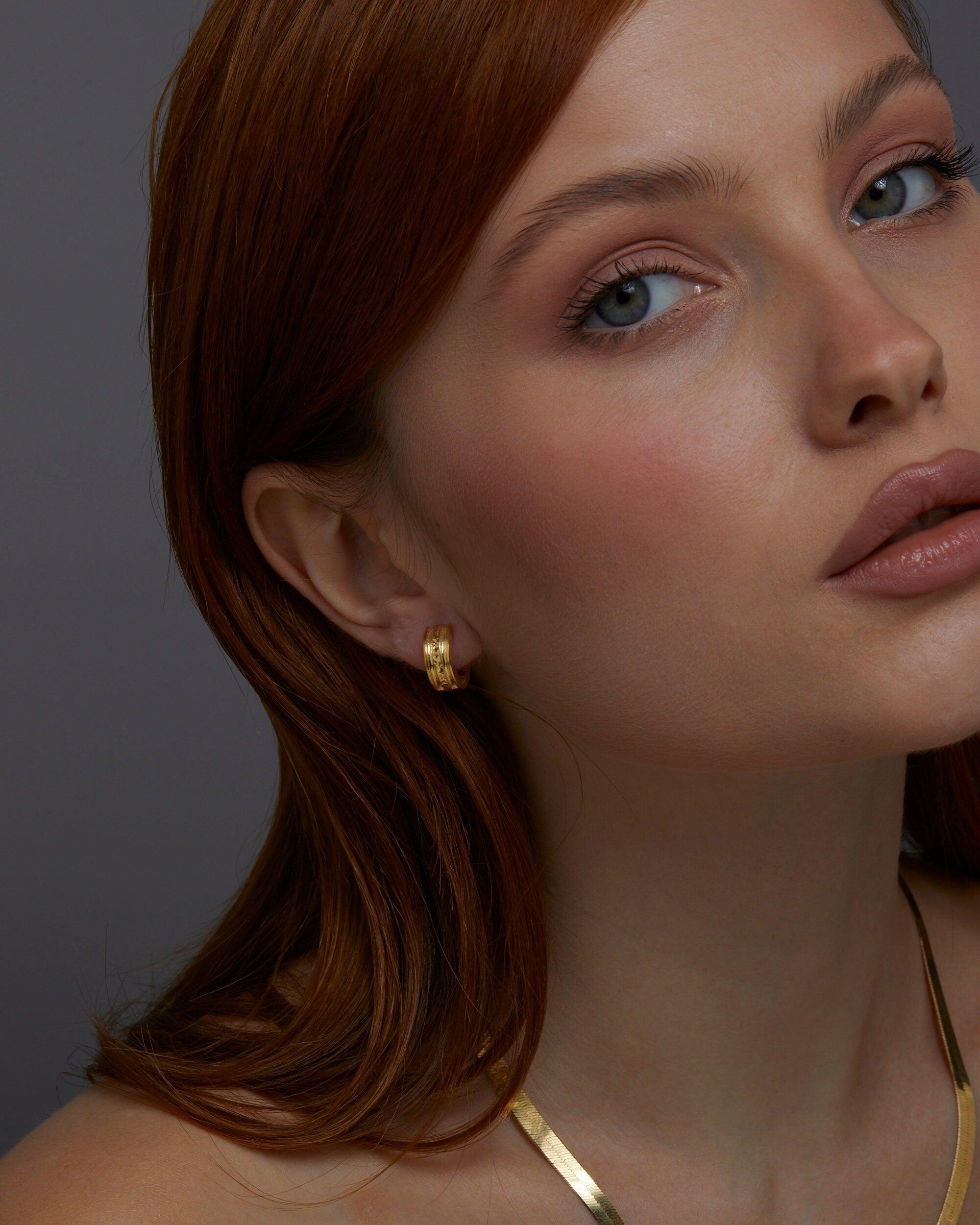 The Fashion Gold Huggie Hoop Earring worn in 18K Gold Vermeil — refined accessory for women. Tarnish-resistant.