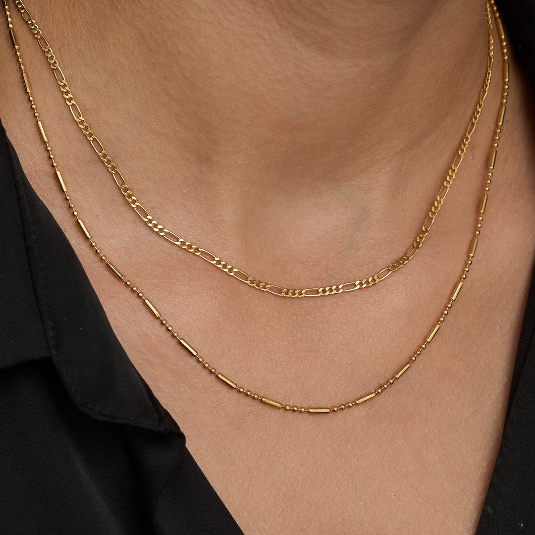 Layered chain necklace look with the gold figaro chain
