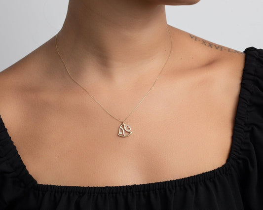 Close detail of the Fish Necklace in 18K Gold Vermeil. Safe for sensitive skin, premium handmade jewelry.