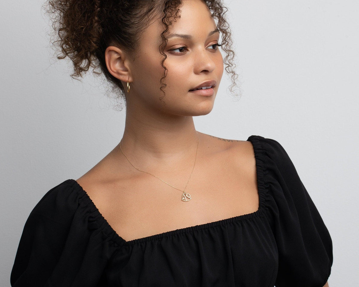 The Fish Necklace styled in 18K Gold Vermeil — elegant everyday jewelry. Hypoallergenic, no green marks.