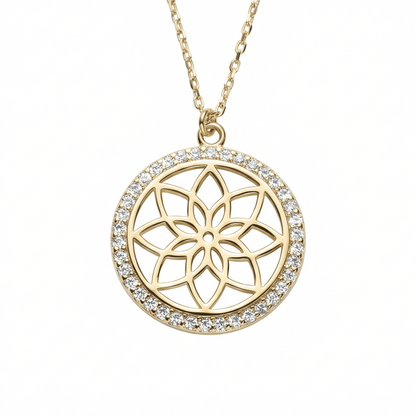 Flower of Life Necklace in 14K solid gold: an openwork eight-petal flower inside a halo of small round CZ stones, on a white background.