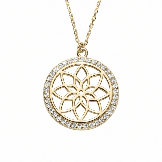 Flower of Life Necklace in 14K solid gold: an openwork eight-petal flower inside a halo of small round CZ stones, on a white background.