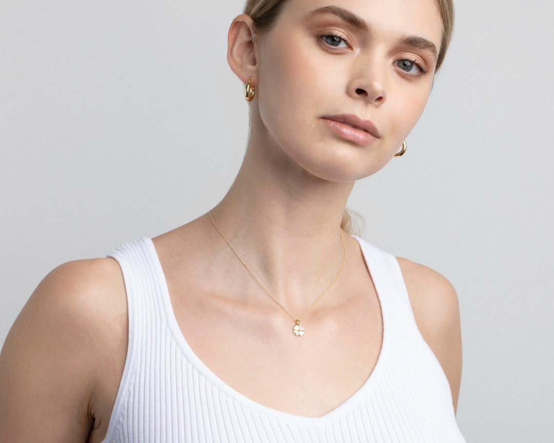 The Four Leaf Clover Necklace styled in 18K Gold Vermeil — elegant everyday jewelry. Hypoallergenic, no green marks.