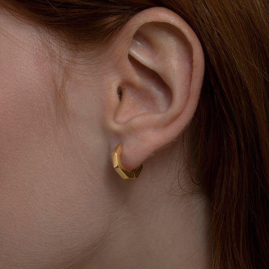 Close detail of the Geometric Hexagon Huggie Earrings in 18K Gold Vermeil. Tarnish-resistant, premium handmade jewelry.