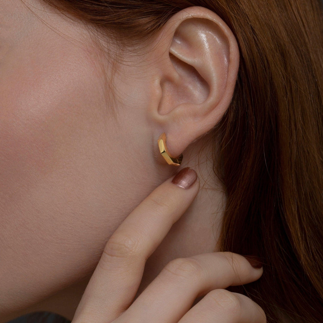 The Geometric Hexagon Huggie Earrings as a daily wear gift in 18K Gold Vermeil. Tarnish-resistant, made for keeping.