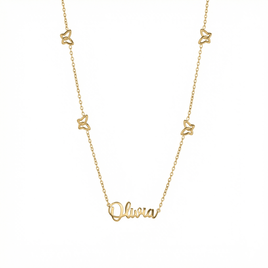 Gold Butterfly Name Necklace — gold script nameplate with four open butterfly charms on a cable chain.