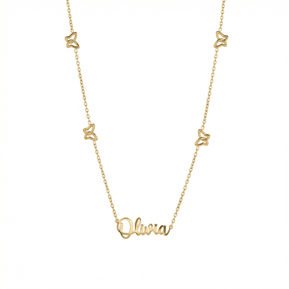 Gold Butterfly Name Necklace — gold script nameplate with four open butterfly charms on a cable chain.